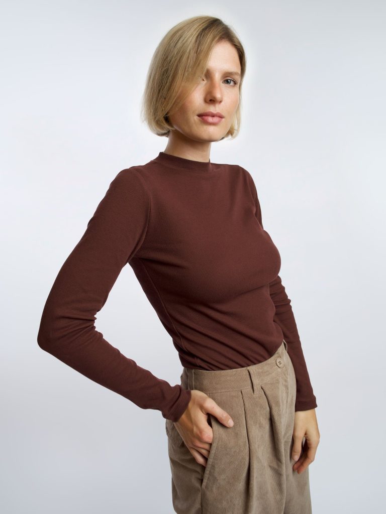Woman wearing an organic cotton dark red long sleeve shirt from affordable sustainable clothing brand Honest Basics