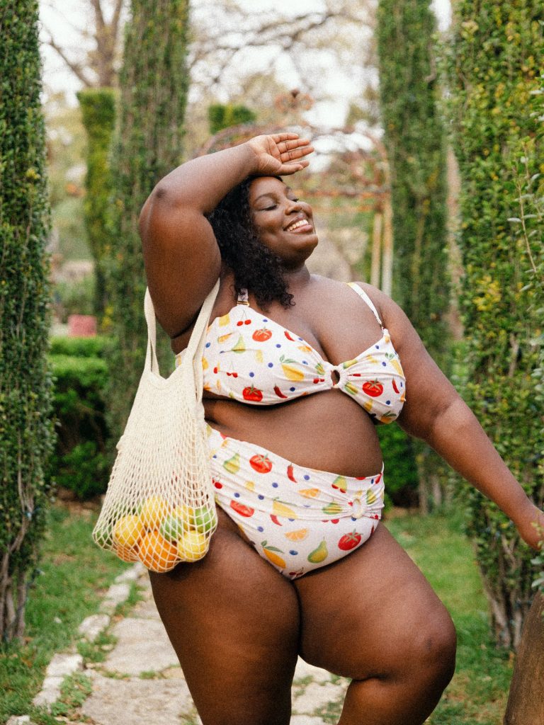 Woman in size inclusive swimwear by Kitty & Vibe. Affordable cute sustainable fashion brand.