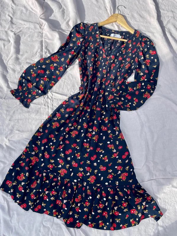A cute vintage looking dress made from deadstock and affordable sustainable fashion brand All the Wild Roses