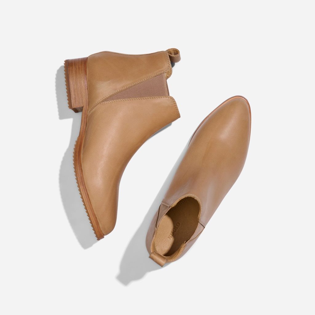 A pair of tan everyday ethical leather boots from Nisolo for sustainable capsule wardrobe shoes