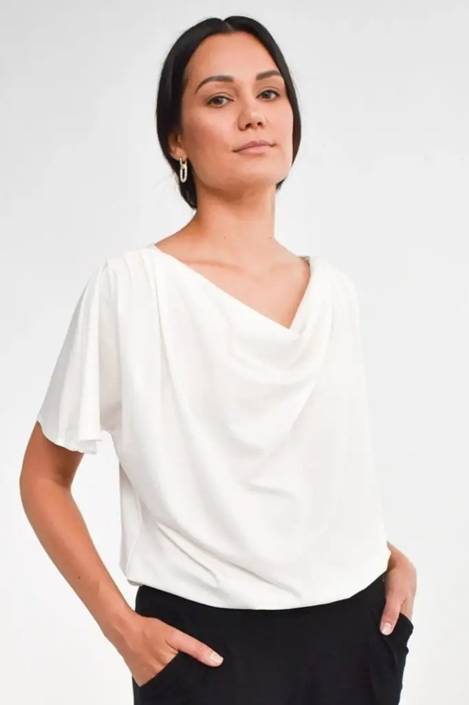 Woman wearing a white modal t-shirt from sustainable brand encircled for a capsule wardrobe