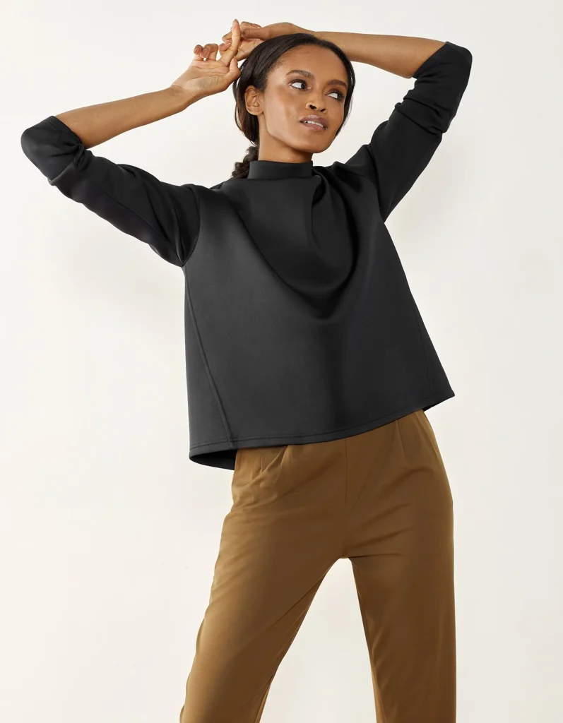 woman wearing sustainable clothes from a brand that empowers women, Aday