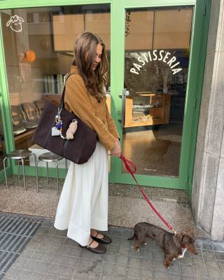 Fashion influencer @lunaisabellaa wearing an on-trend spring outfit trend for 2025.