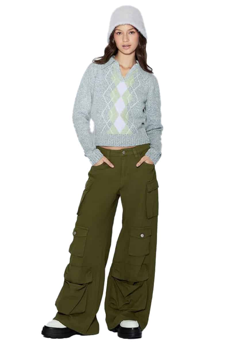 Model wears cargo pants and sweater. 
