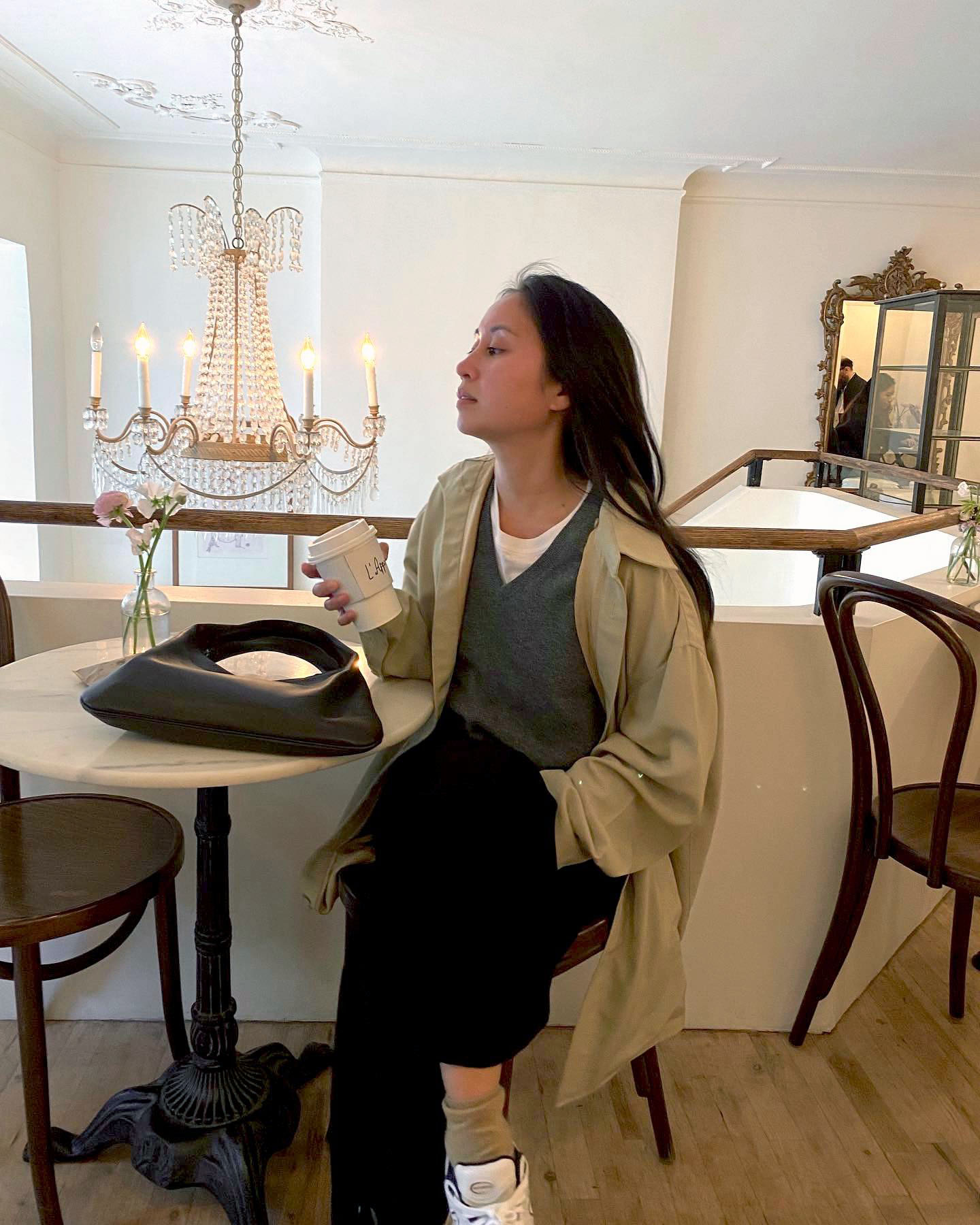 Jordan Risa Santos 6 Effortless Outfit Formulas That Are Easy to Pull Off Trench Coat Sweater Black Pants Sneakers Spring Outfit Idea