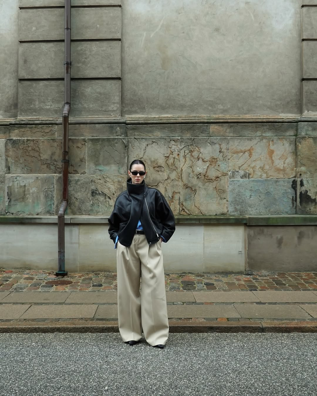 Christina Stougaard wearing a funnel neck bomber jacket with trousers