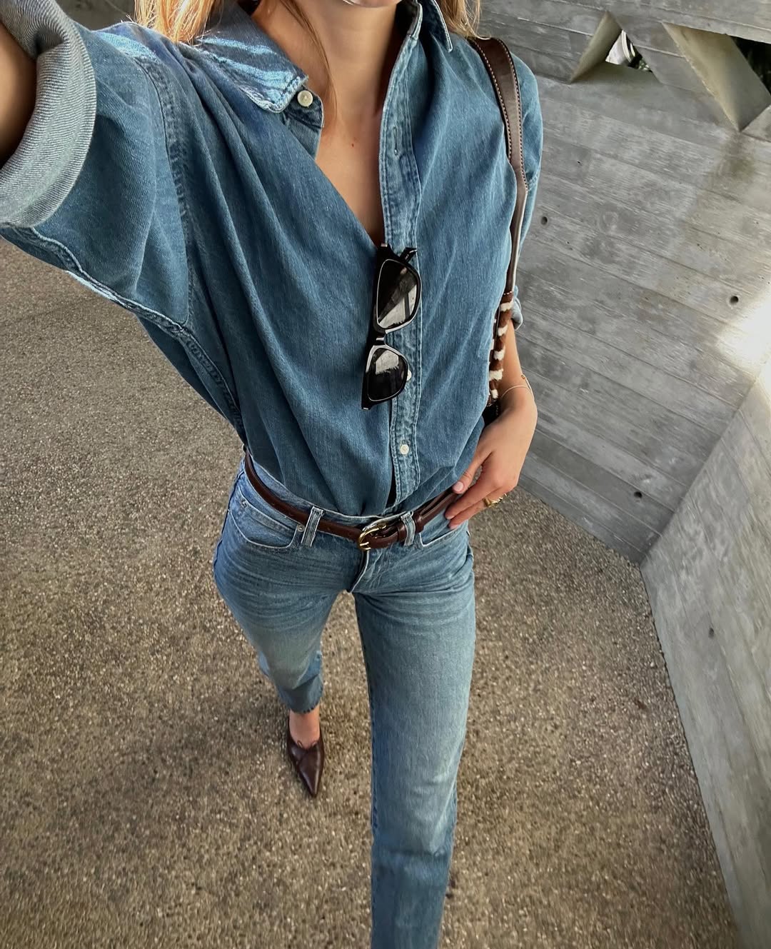 woman wearing denim on denim outfit with belt