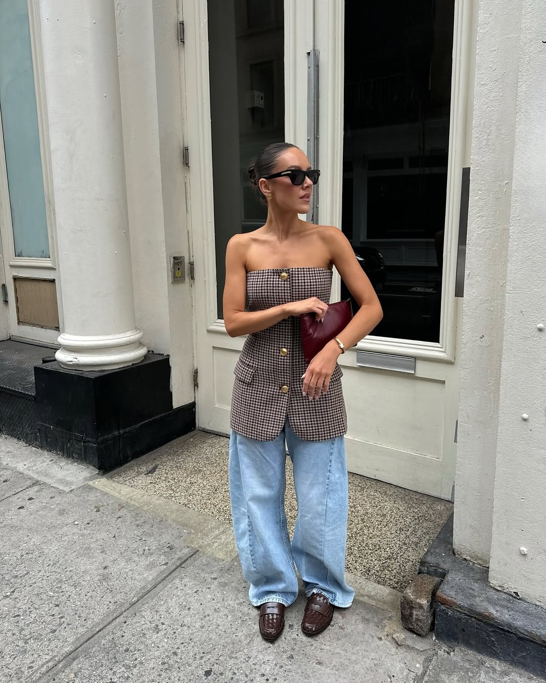 woman wearing strapless long top with loose jeans and loafers
