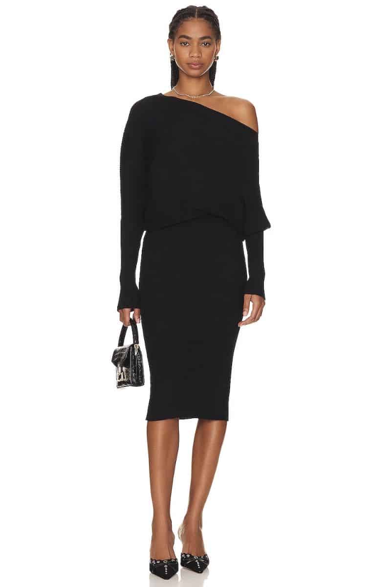 Model wears classy sweater dress with one-shoulder style. 