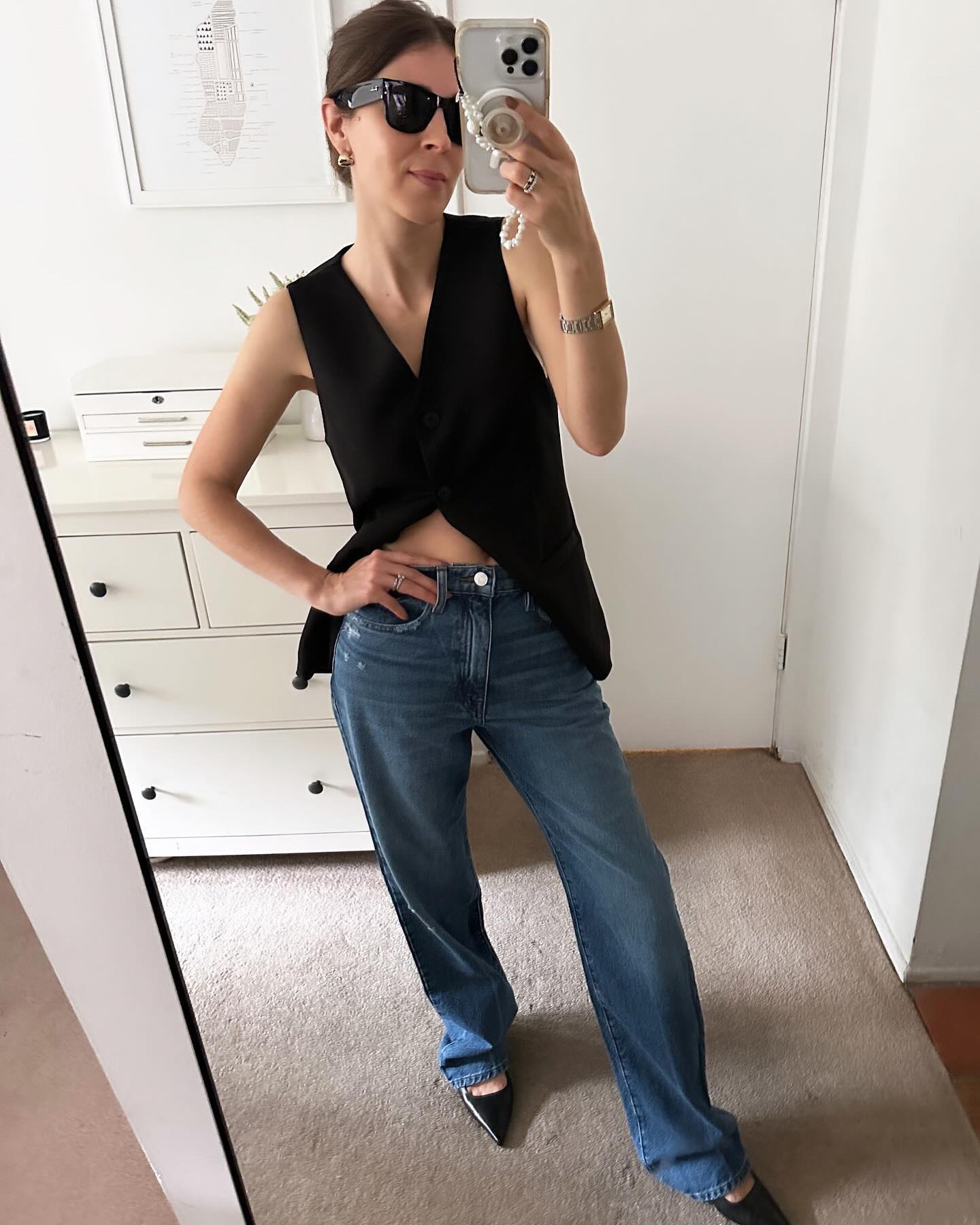 Judith Jones wearing Maje black slingback pumps