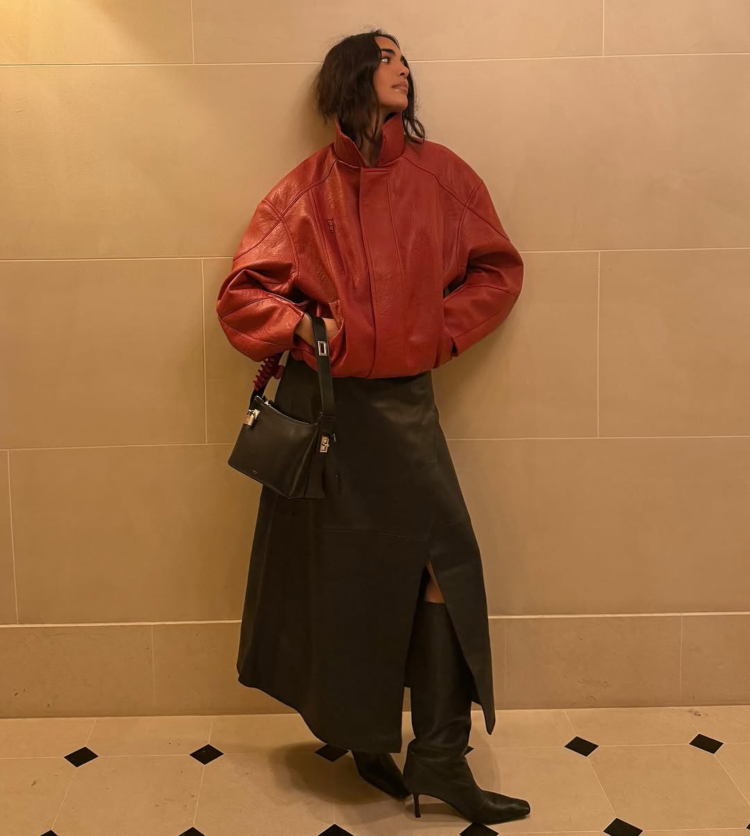 Sandra Shehab wearing a funnel neck bomber jacket