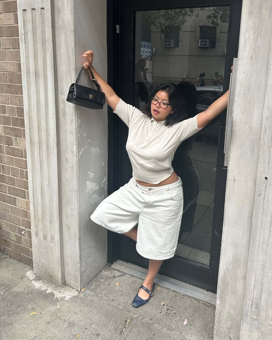 woman wearing white long denim shorts and t-shirt