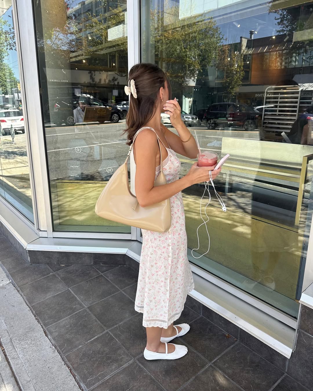 Woman wearing slip midi dress and ballet flats in a summer 2025 outfit.