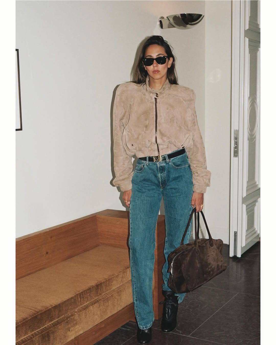 Hanna MW wearing a brown suede funnel neck bomber jacket