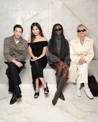 Adrien Brody, Gemma Chan, Jodie Turner-Smith, and Sharon Stone sitting front row at the COS S/S 25 show in Greece.
