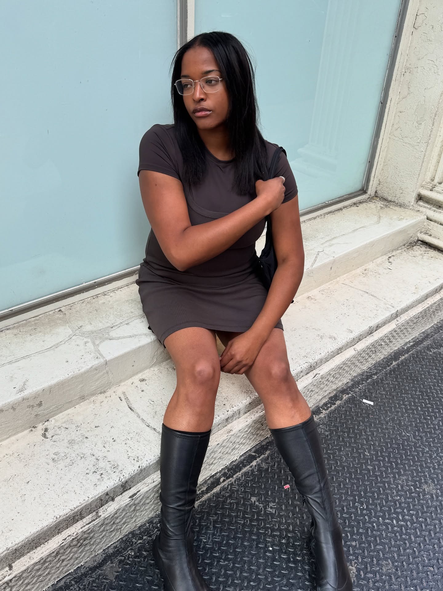 '90s-inspired outfit including a T-shirt dress and knee boots