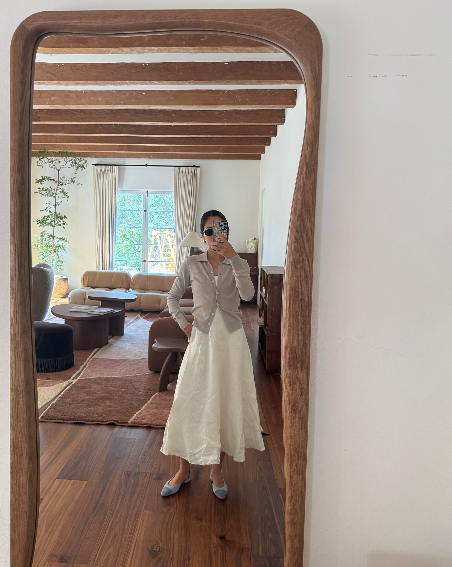 '90s-inspired outfit including a white dress and cardigan