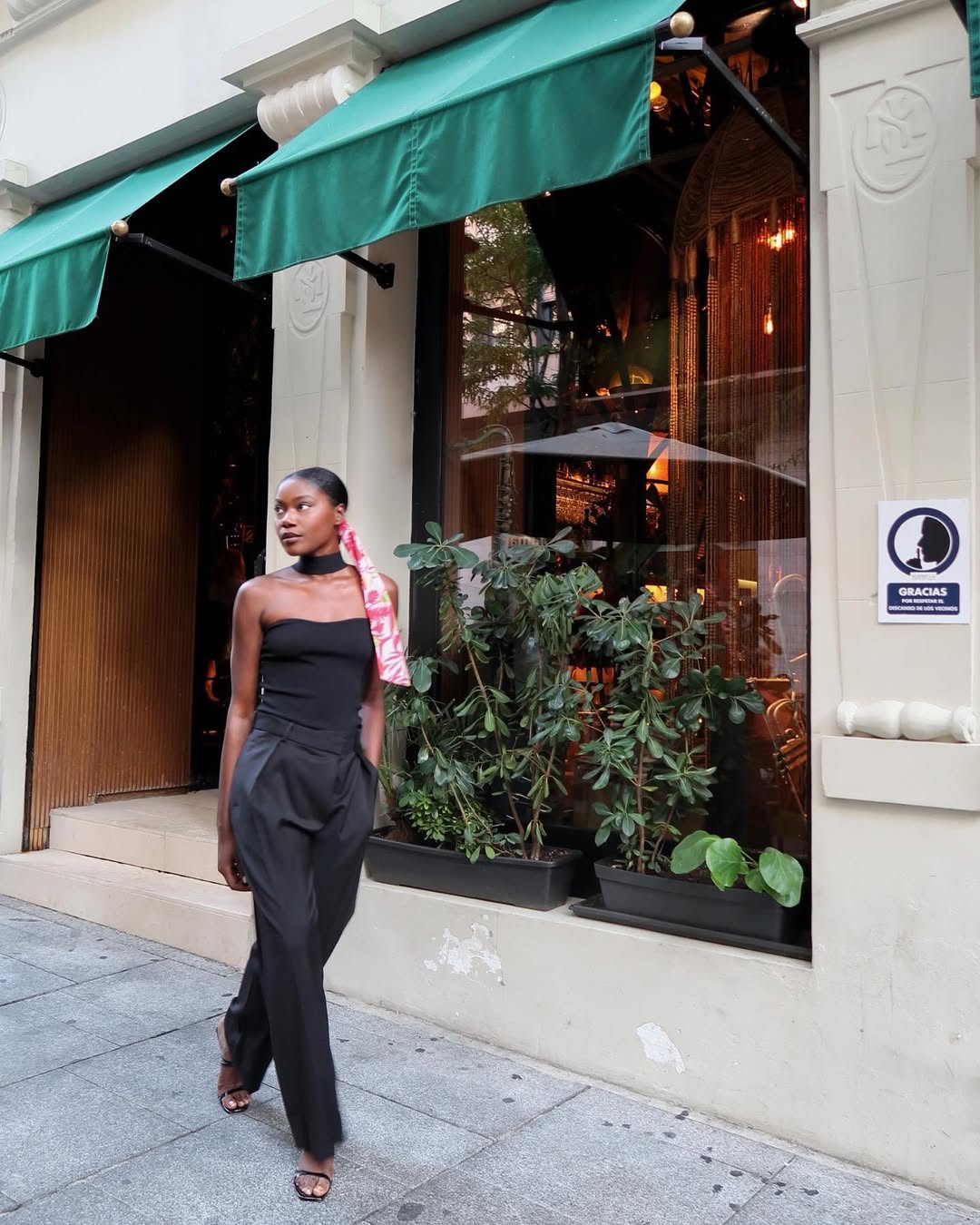 woman wearing black tube top and trousers