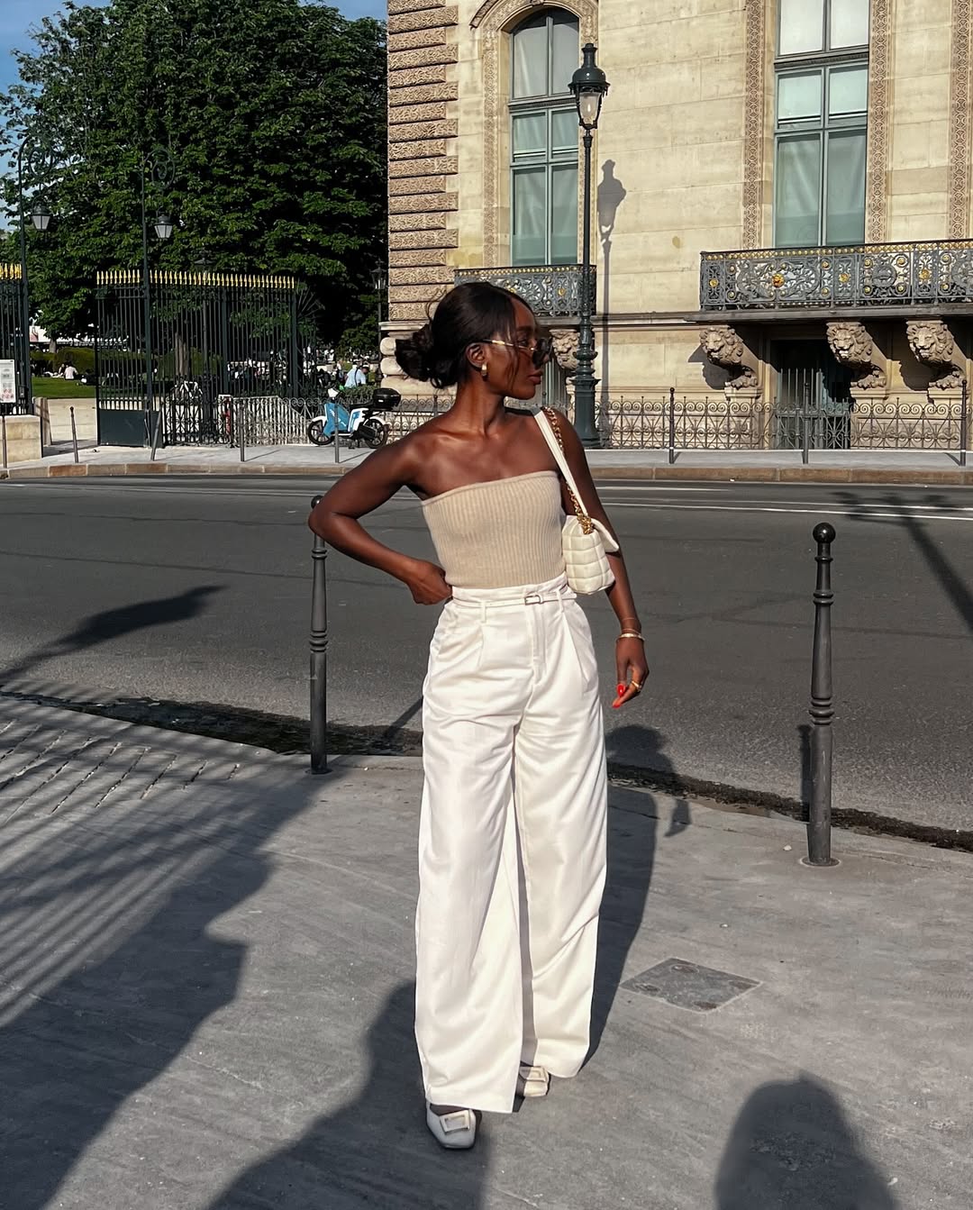 woman wearing ballet flats with white pants summer 2025