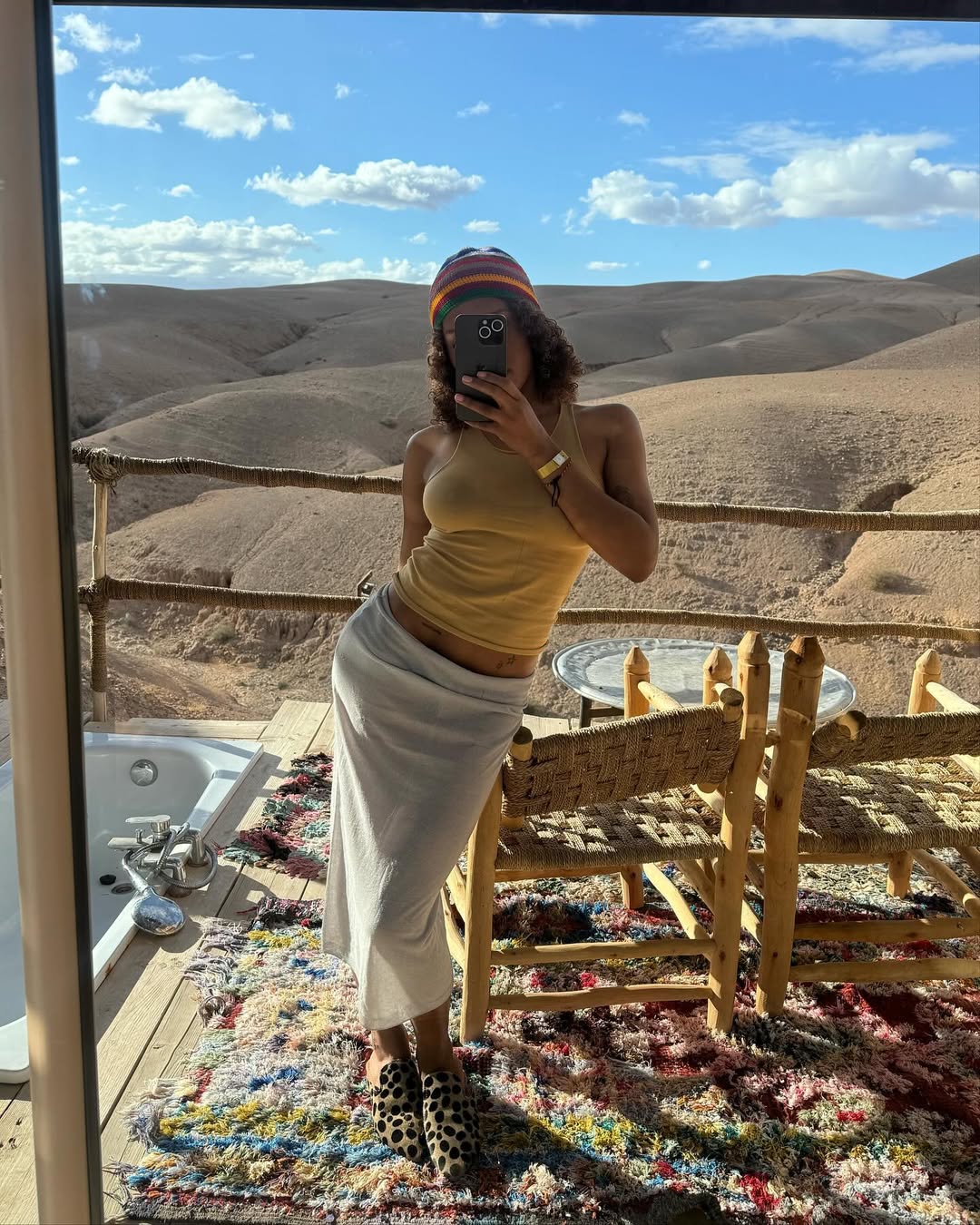 woman wearing butter yellow tank and midi skirt