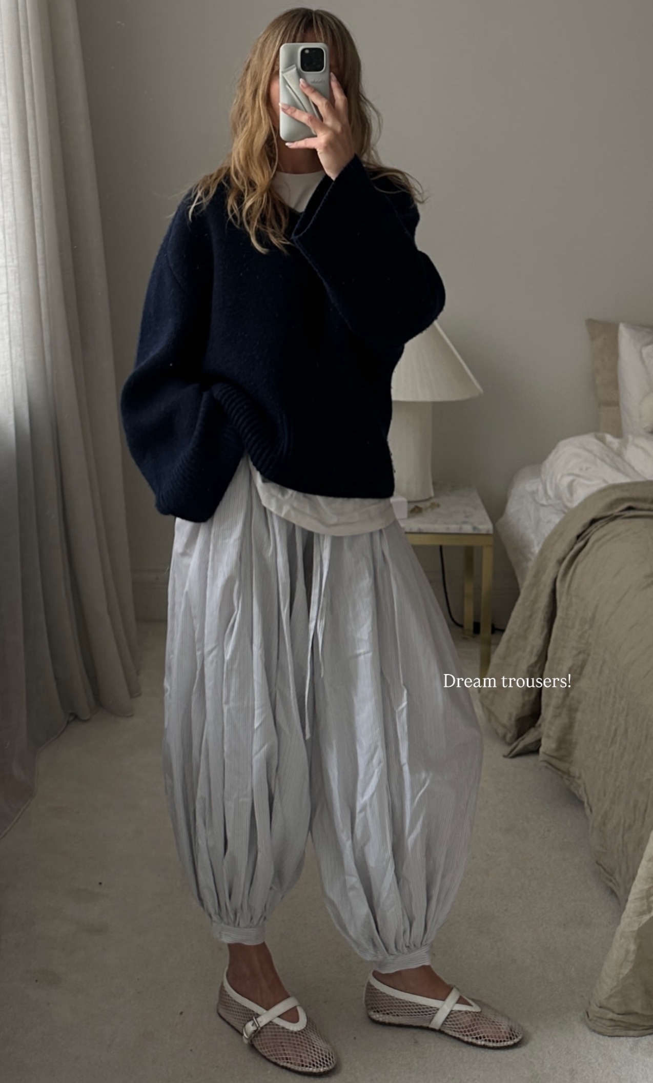 @_jeanettemadsen_ wearing a black jacket and Zara genie pants with net Alaïa flats.