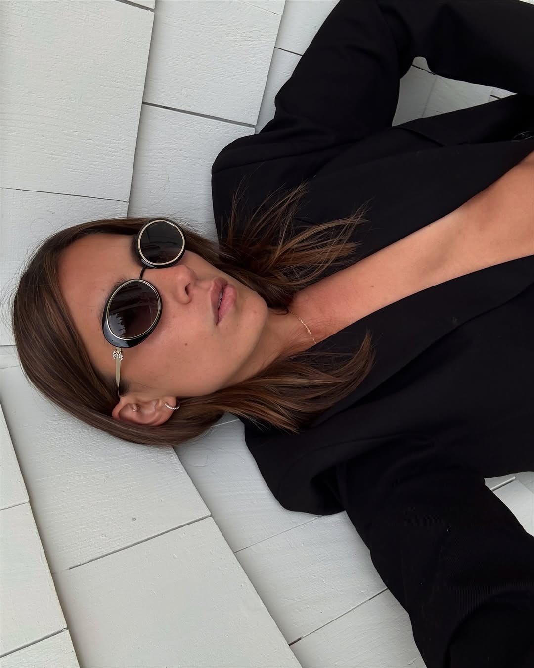 Woman wearing sunglasses.