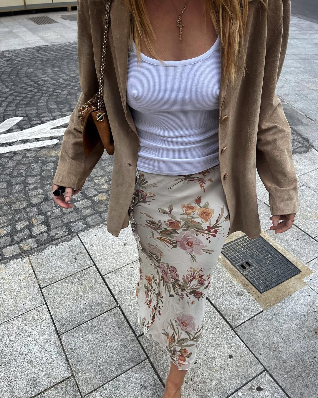 woman wearing floral midi skirt and white tank