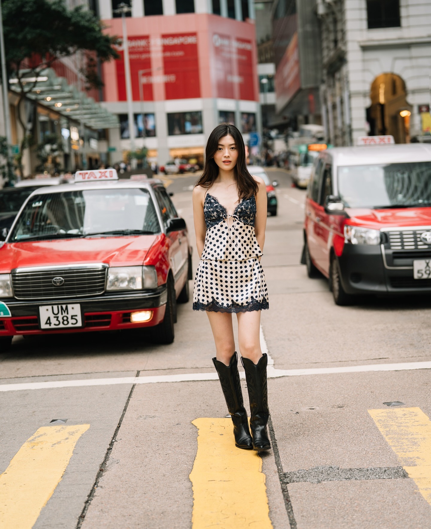 Photo of Rina Hiramatsu wearing lace slip skirt while standing on street.