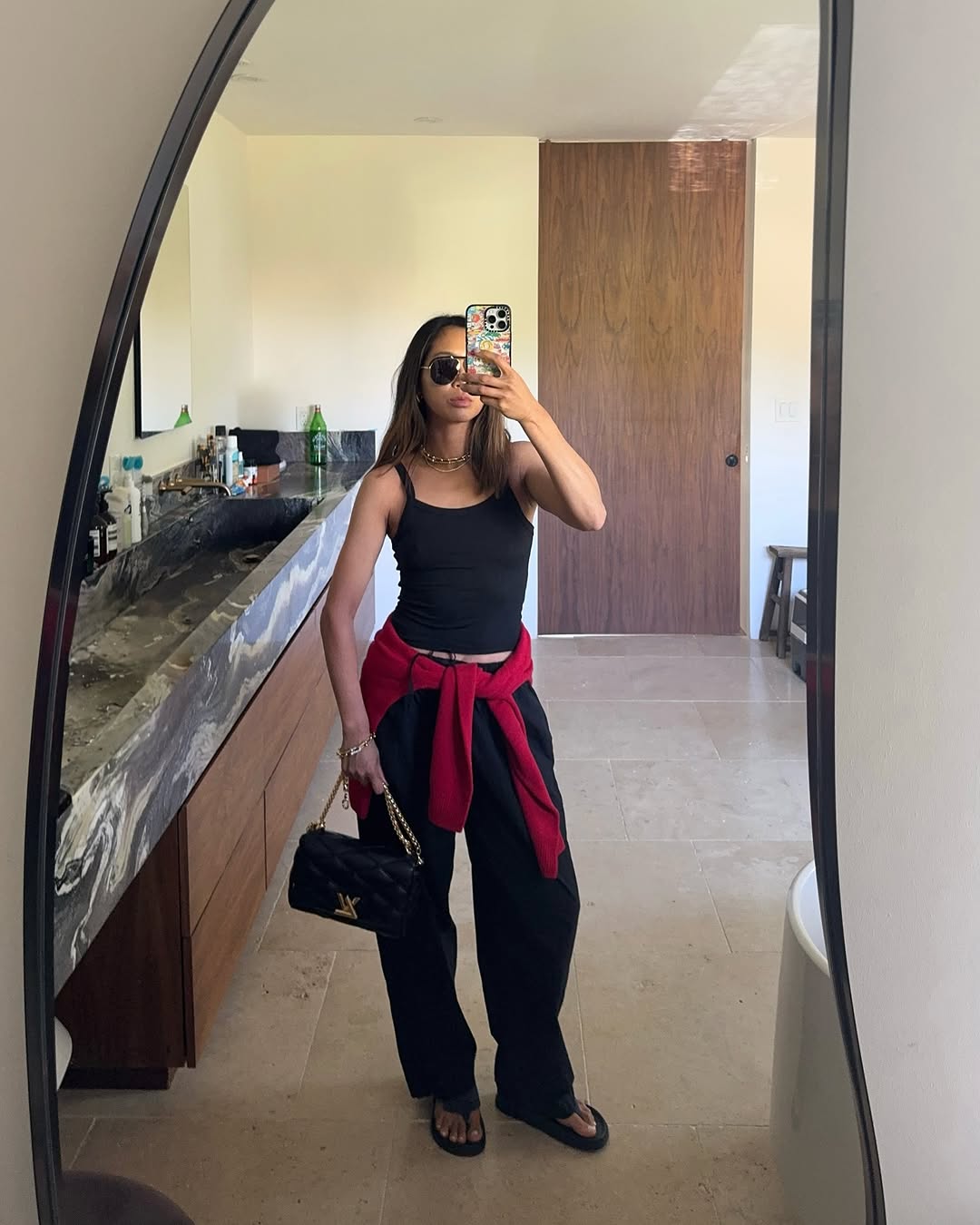 Woman wearing trouser pants and flip flops summer 2025.