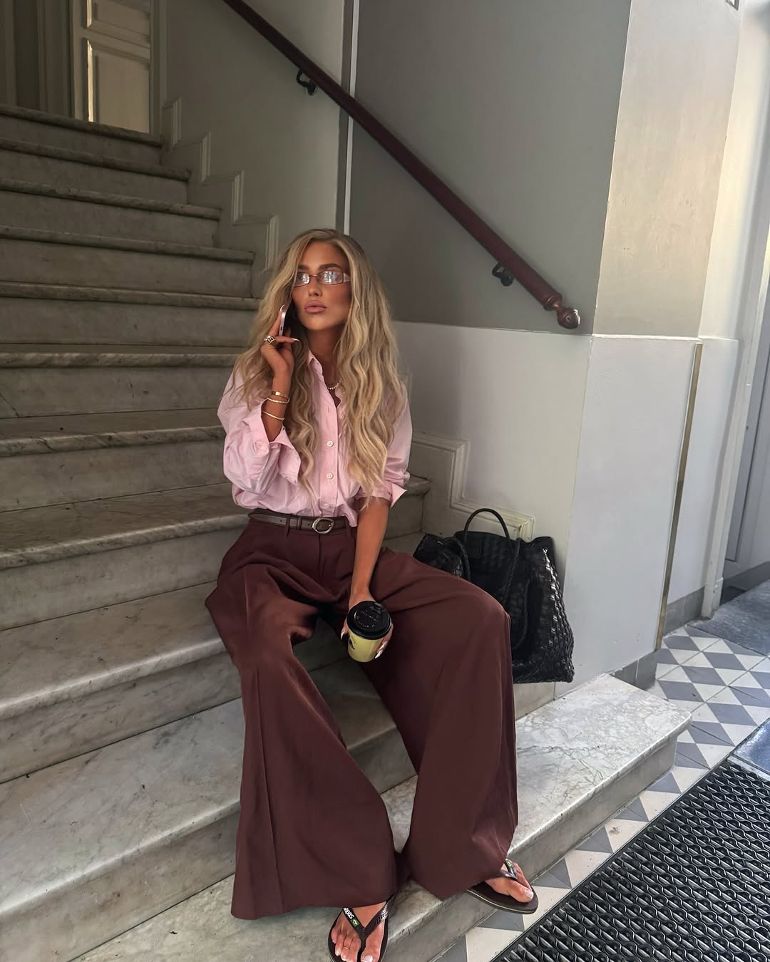 Woman wearing trouser pants and flip flops summer 2025.