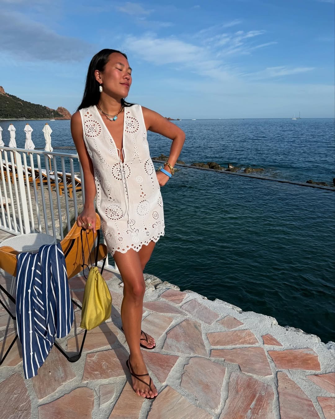 Woman wearing a broderie anglaise dress.