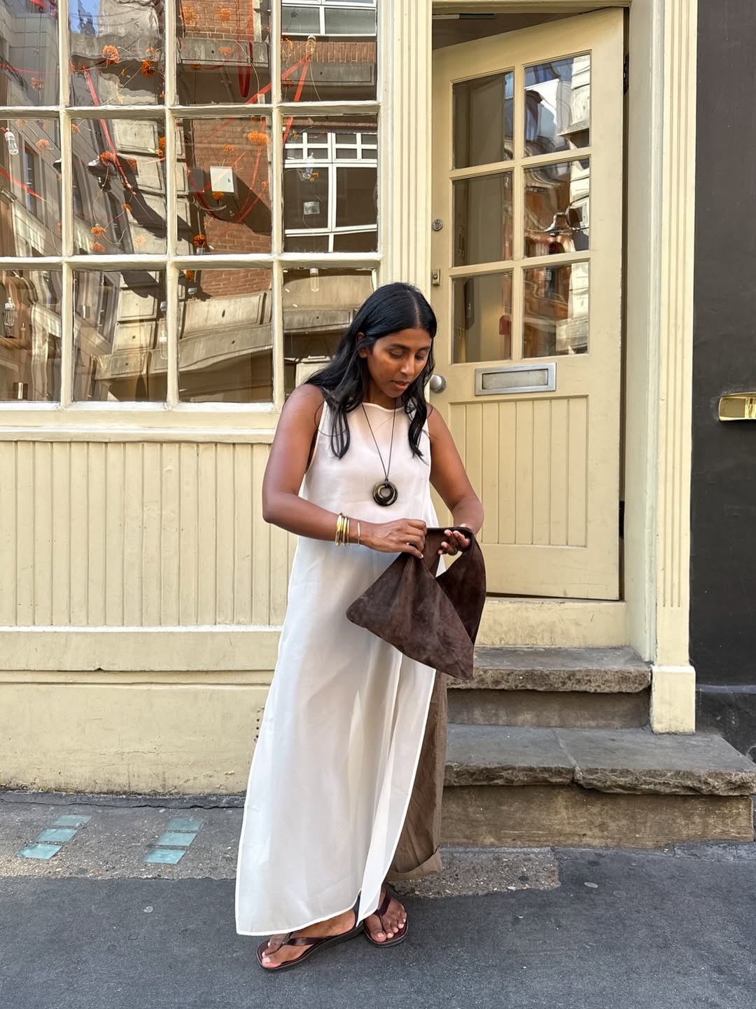 Monikh in an off-white maxi dress