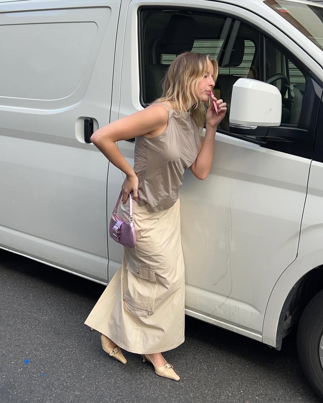 Woman wearing camel-colored outfit summer 2025.