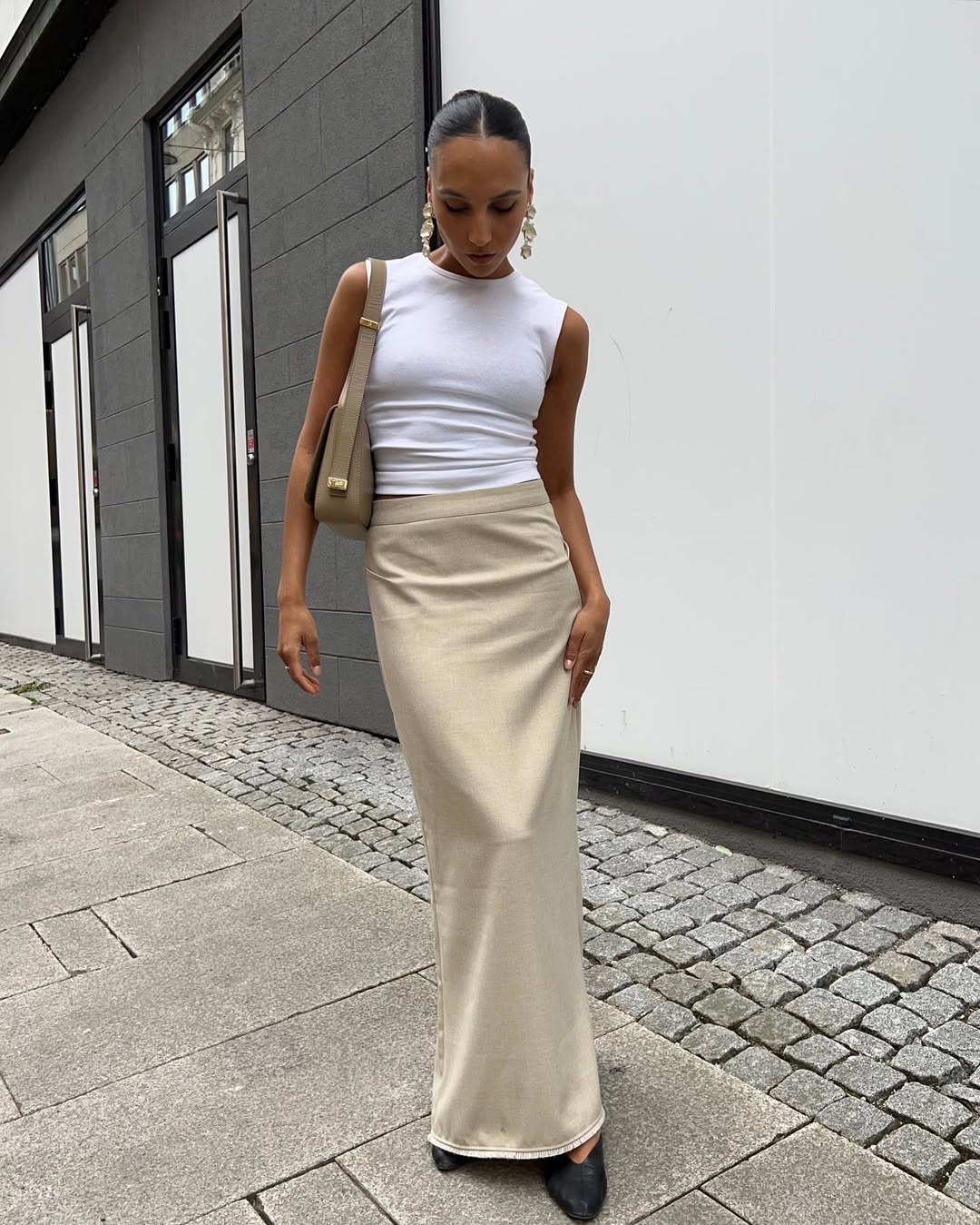 Woman wearing camel-colored outfit summer 2025.