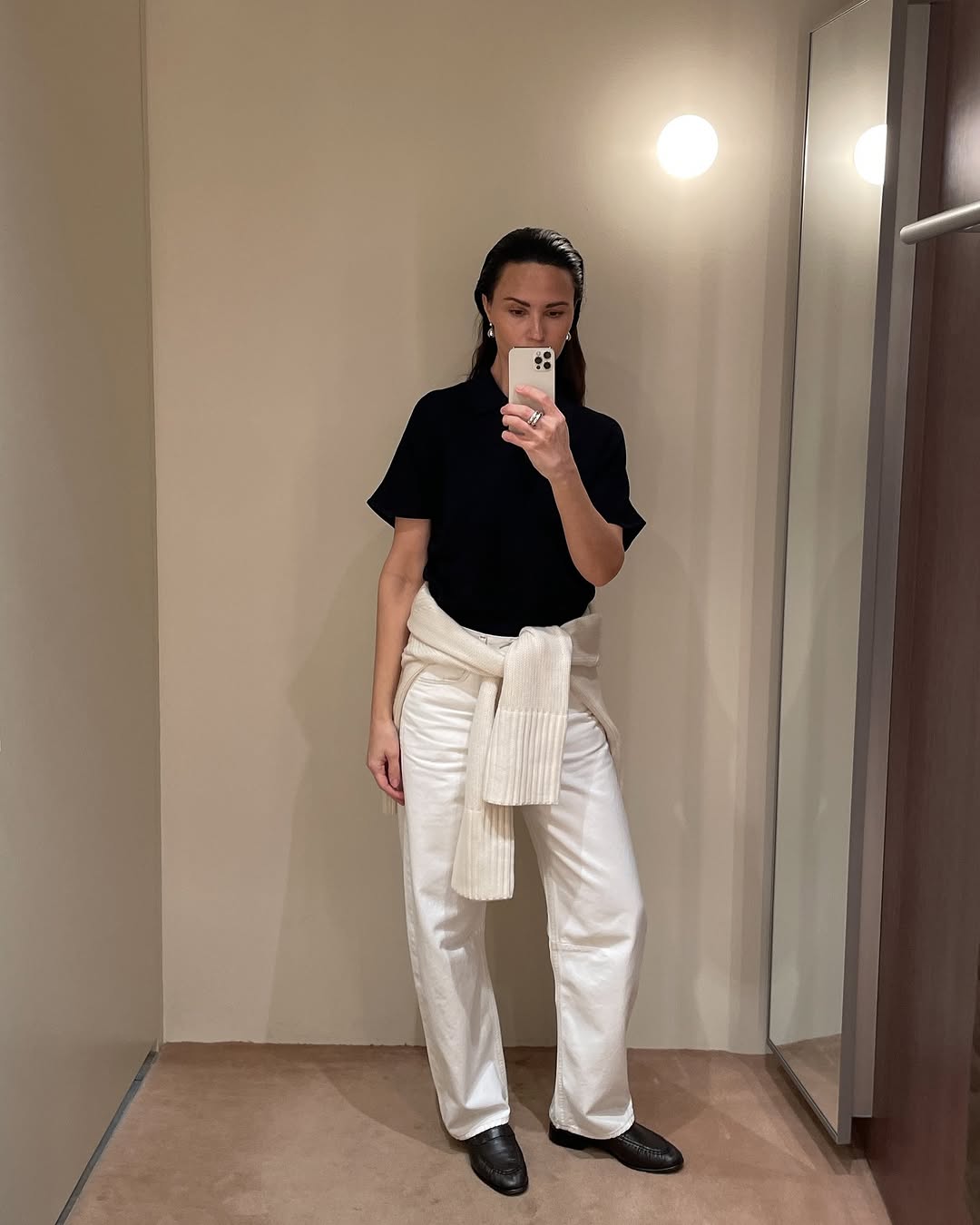 Woman wearing sweater styling idea for summer 2025.