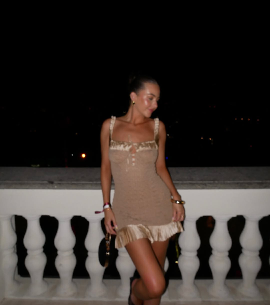 Woman wearing camel-colored outfit summer 2025.