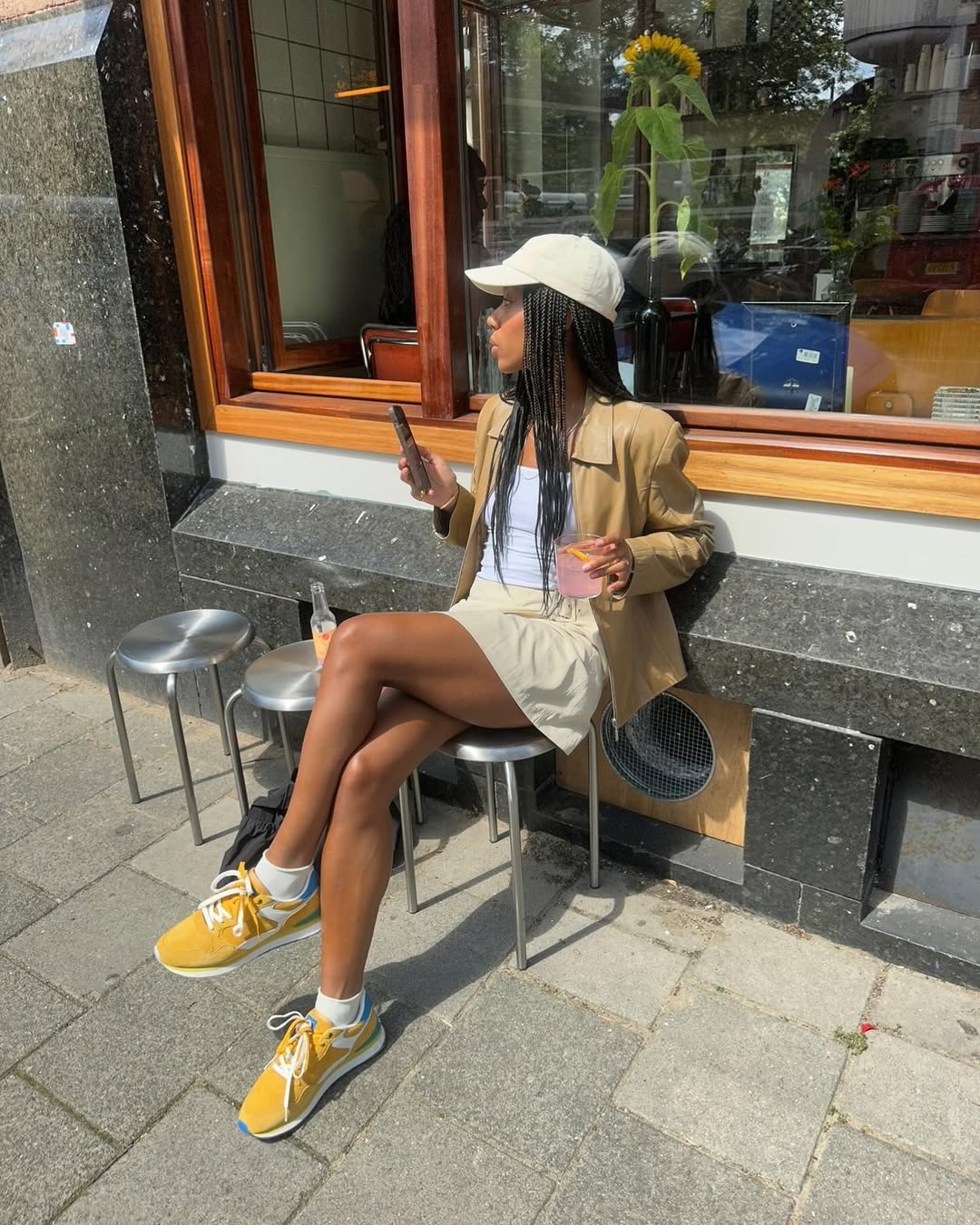 Woman wearing camel-colored outfit summer 2025.