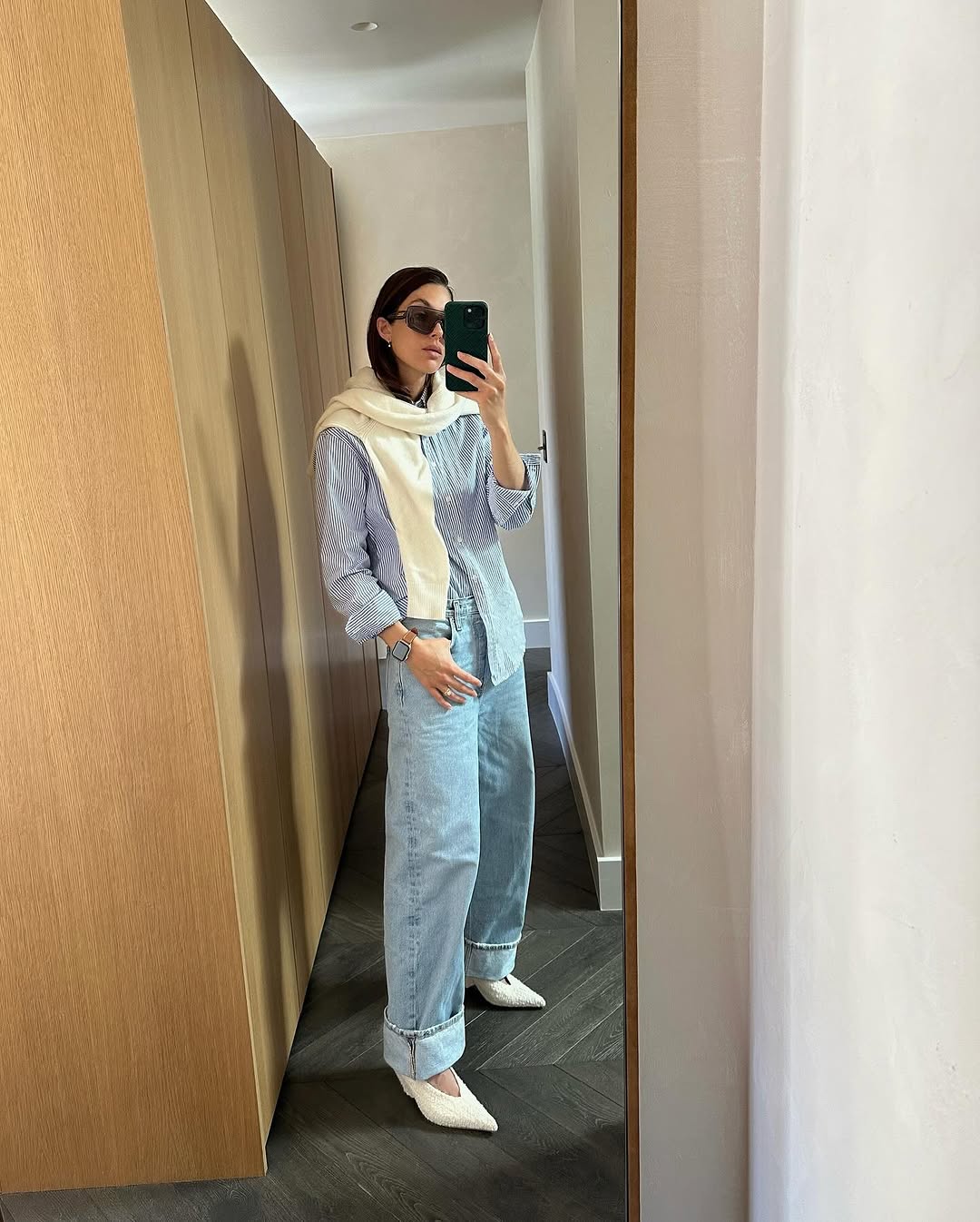 Woman wearing sweater styling idea for summer 2025.