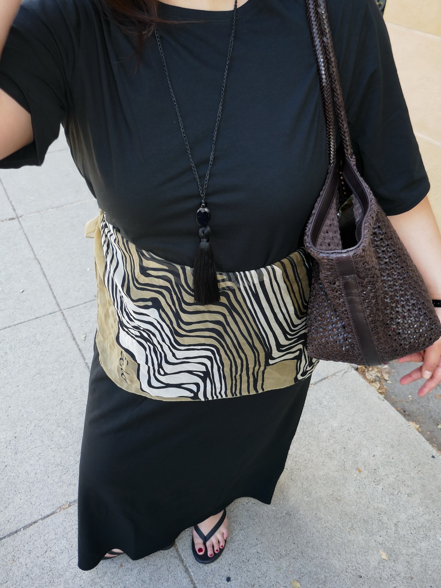 An image of @marina_torres wearing a scarf belt, one of the biggest summer accessories.