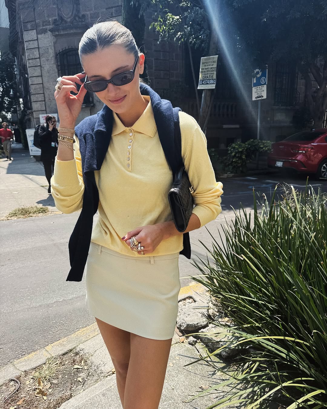 Woman wearing sweater styling idea for summer 2025.