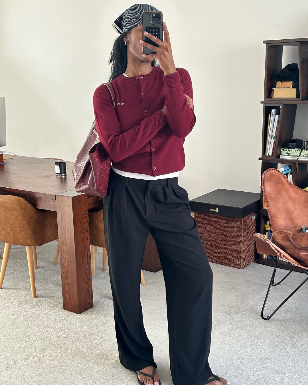 Woman wearing trouser pants and flip flops summer 2025.