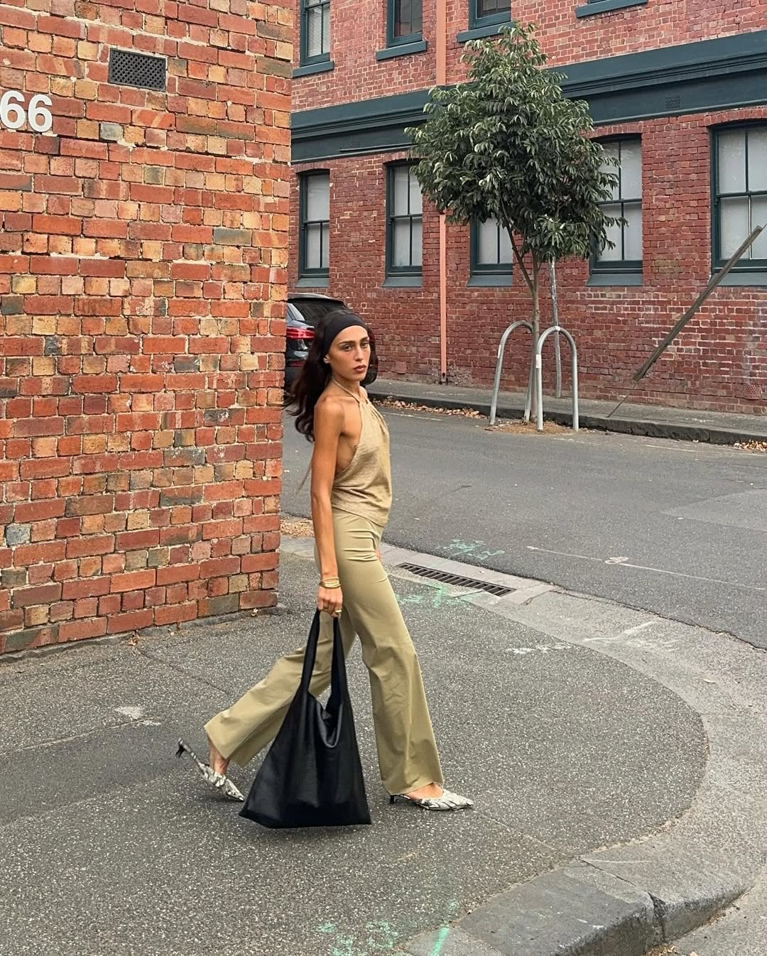 Woman wearing camel-colored outfit summer 2025.