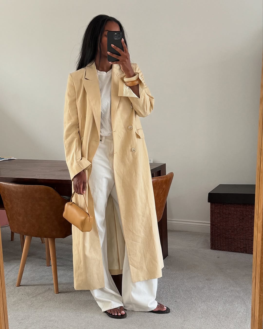 Woman wearing camel-colored outfit summer 2025.