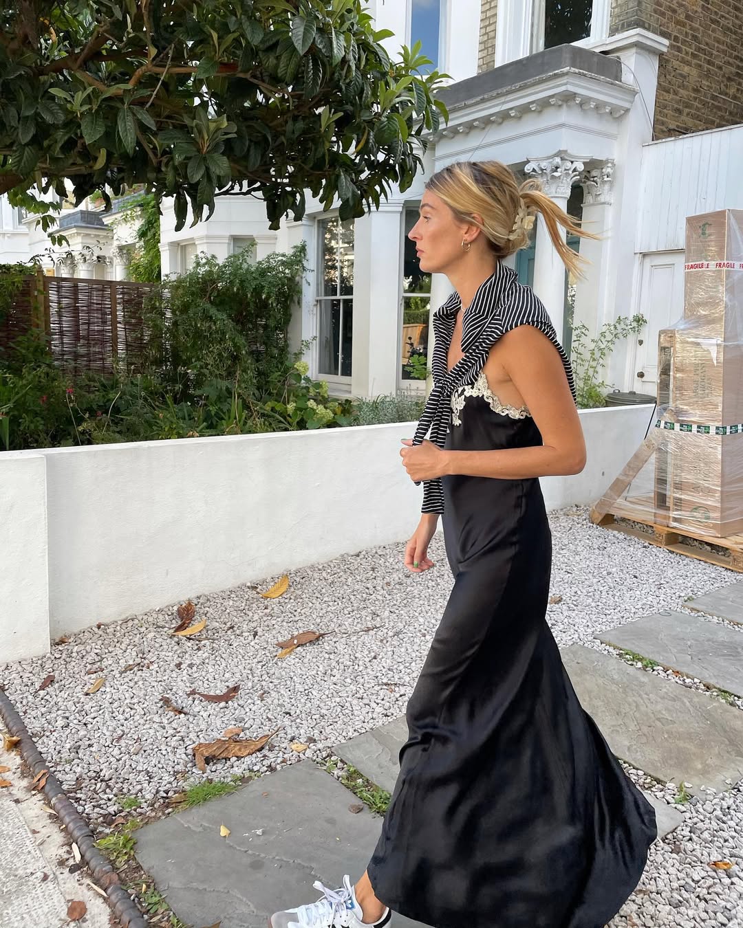 Woman wearing sweater styling idea for summer 2025.