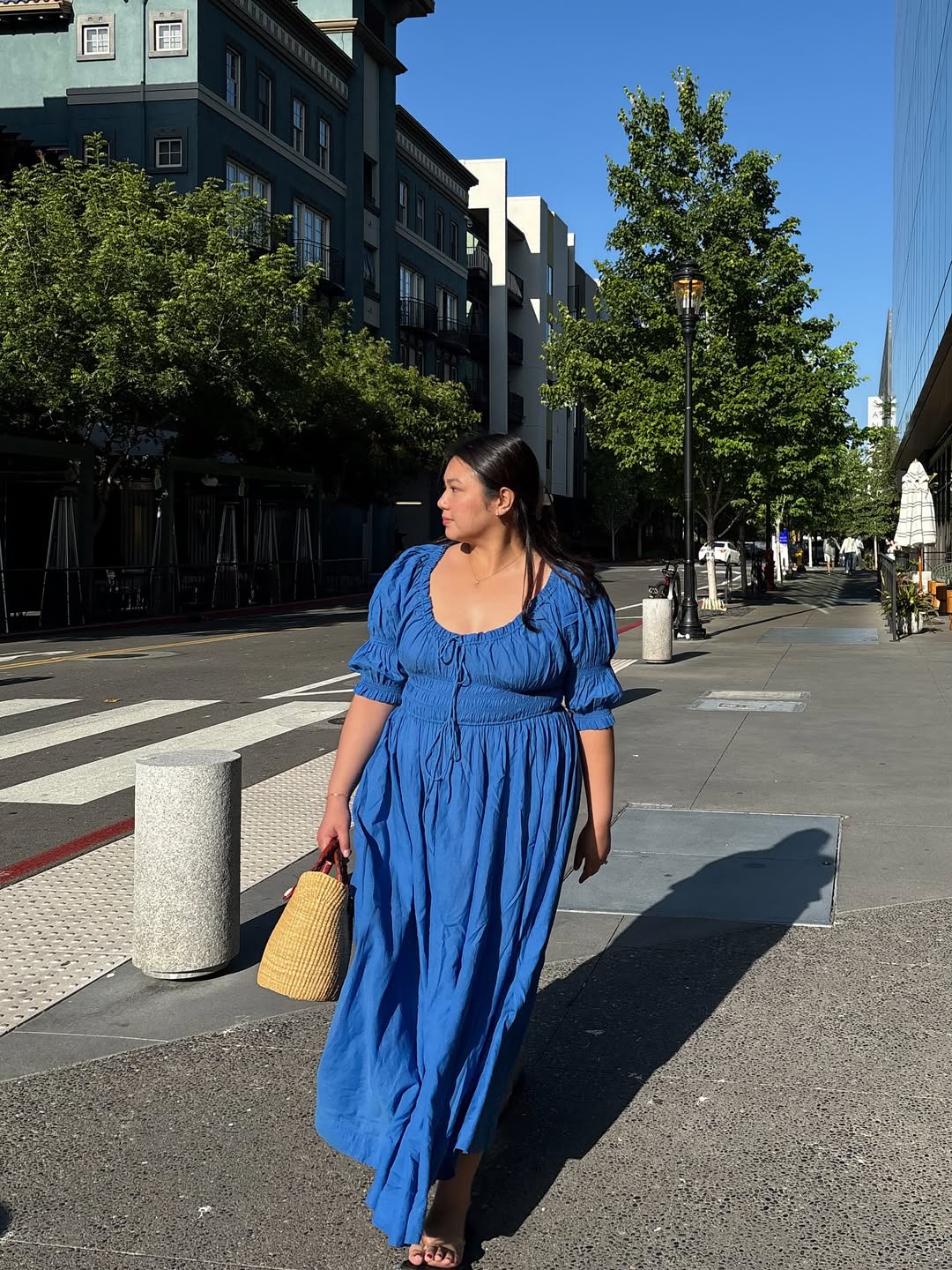 European influencer in blue Doen dress