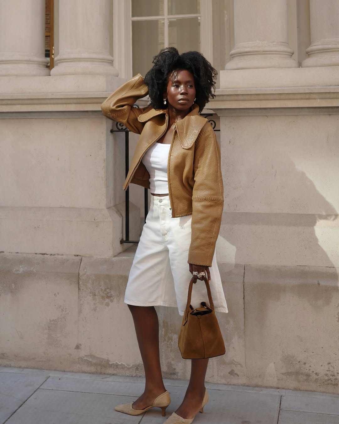 Woman wearing camel-colored outfit summer 2025.