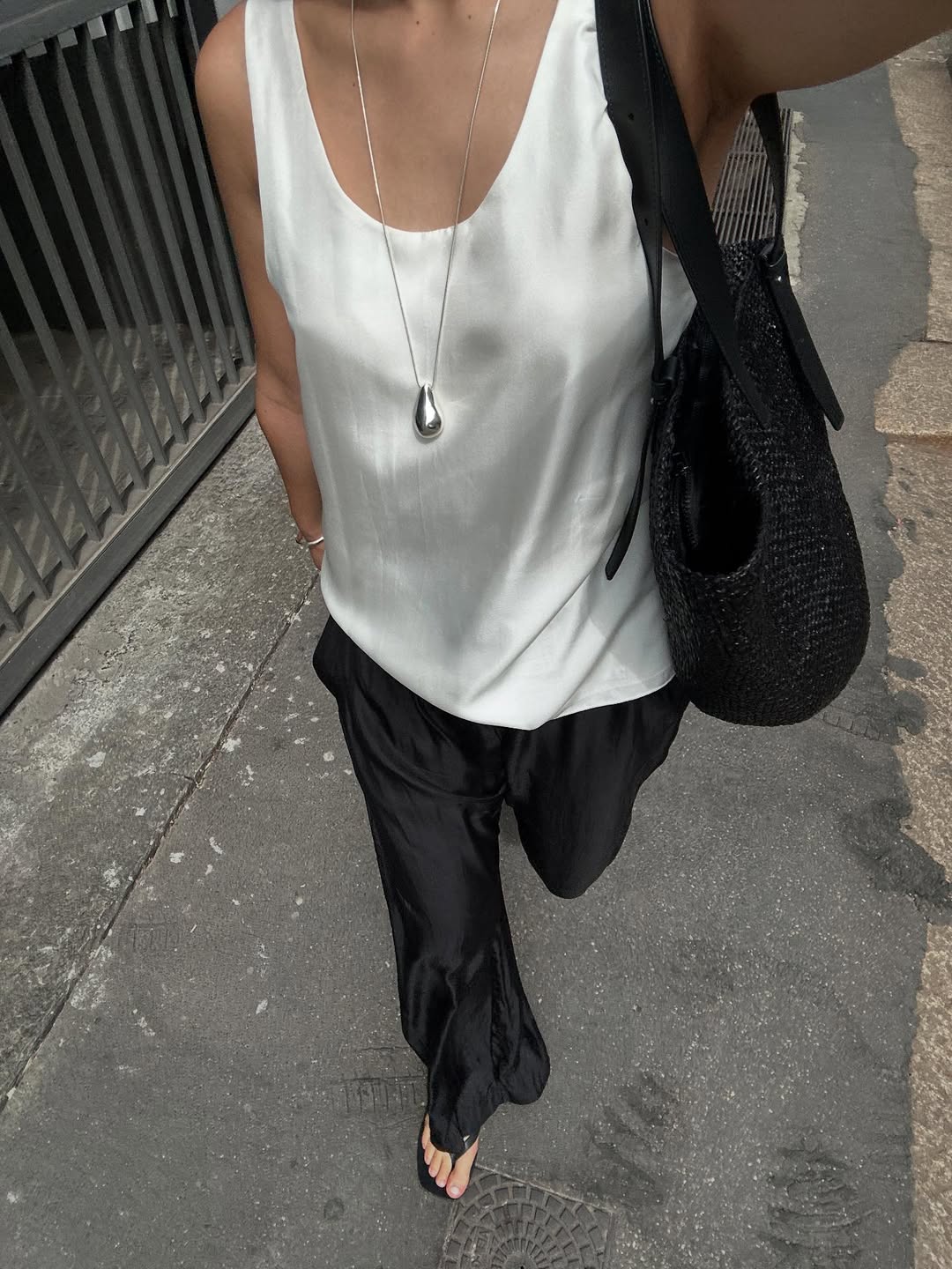 Selena Mual wearing silk pants.