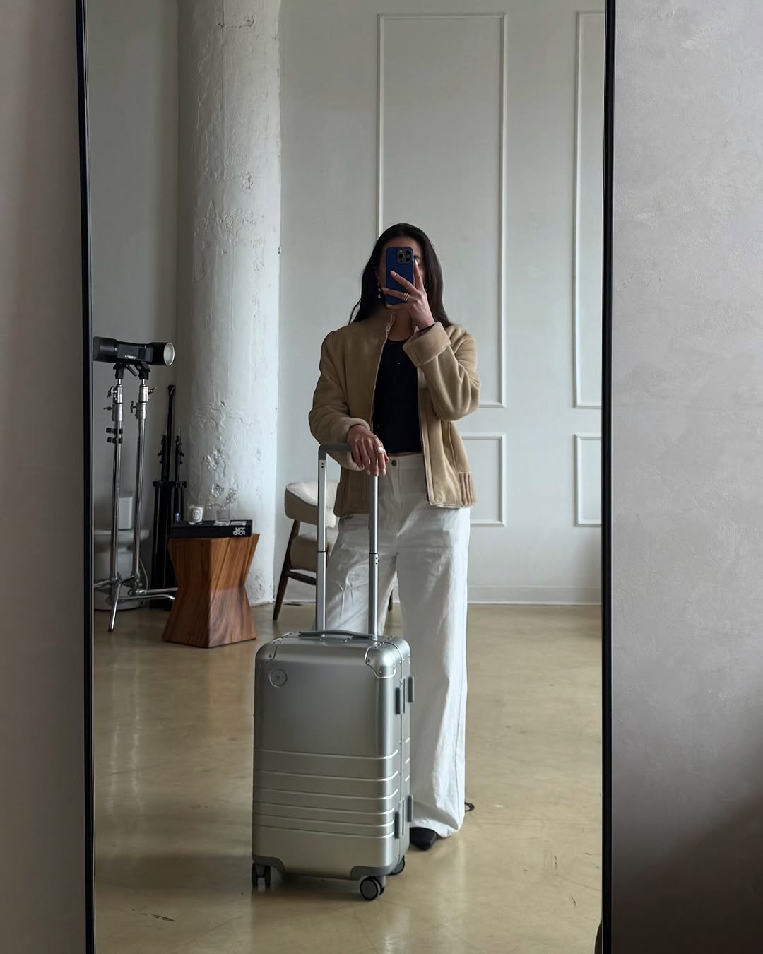 Woman wearing chic airport outfit 2025.