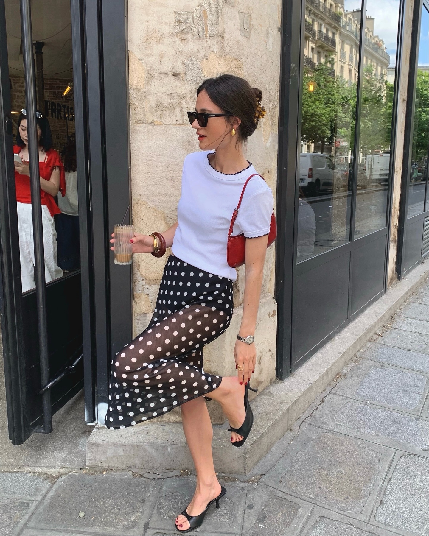 A French woman in a polka-dot skirt