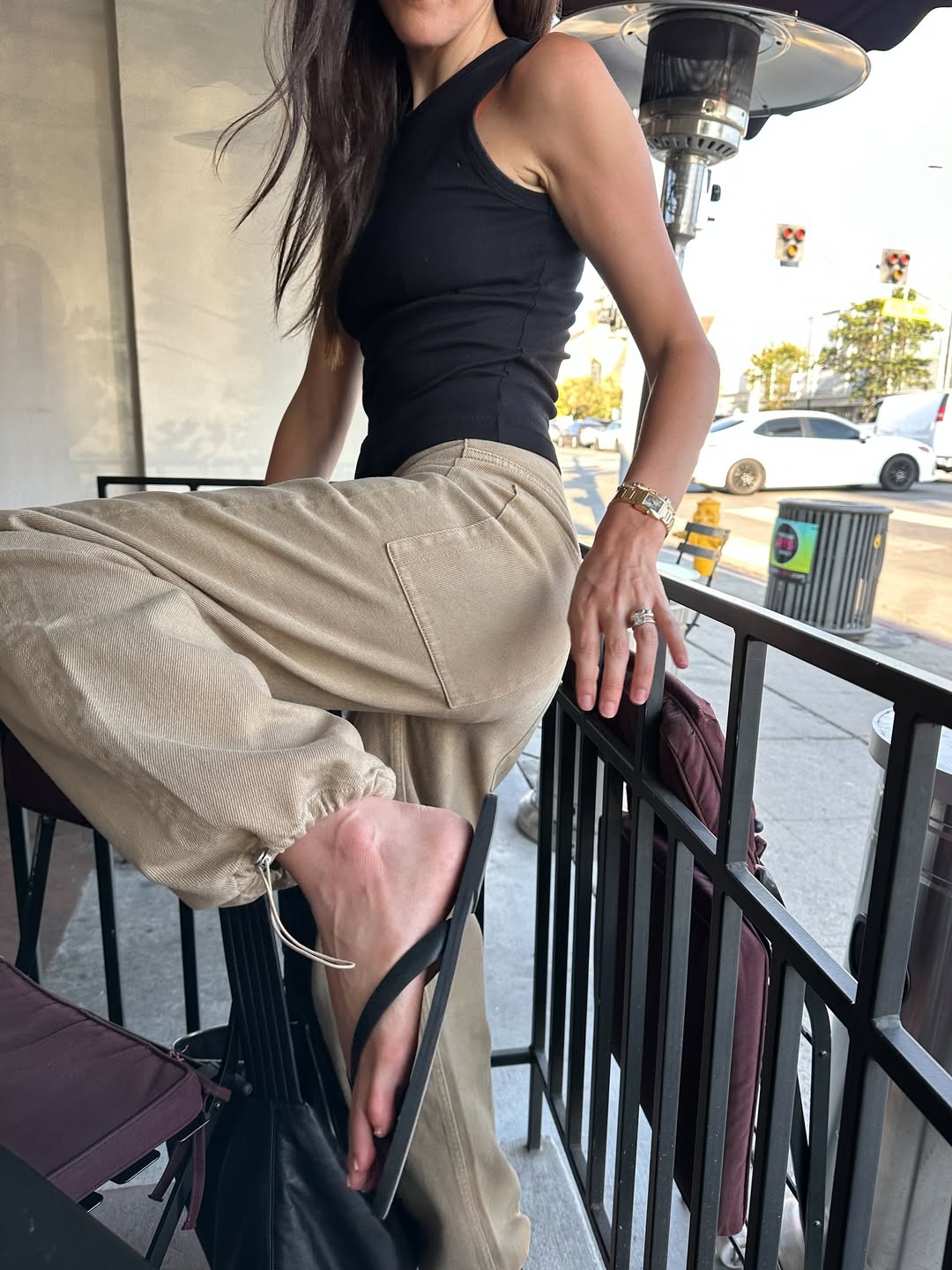Woman wearing khaki jeans.